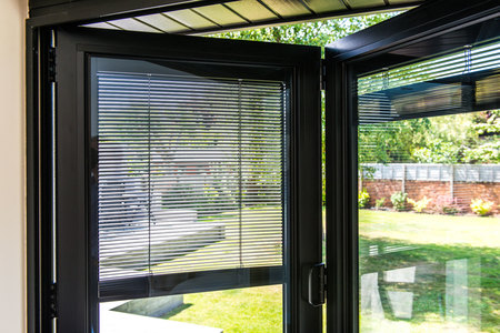 black bifold door with integral blinds